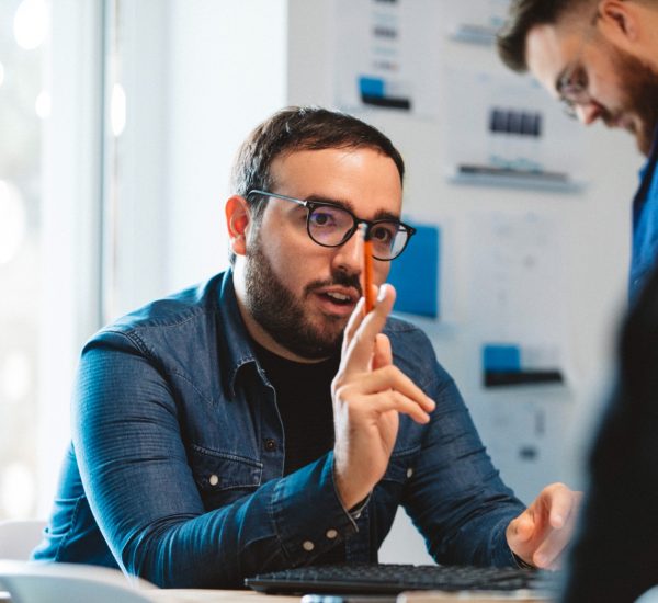 Andrea Motta sitting in a meeting room
